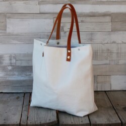 Bolso de tela con aplicaciòn cuero o cuerina